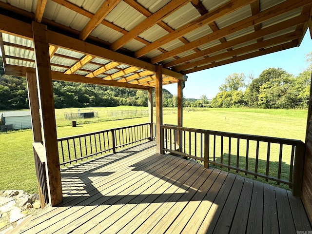 wooden deck with a lawn