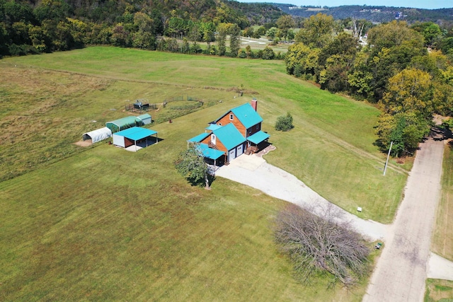 birds eye view of property with a rural view