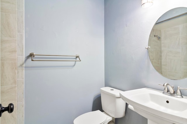 bathroom featuring sink and toilet