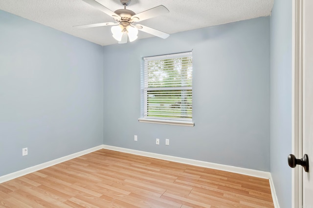 unfurnished room with ceiling fan, light hardwood / wood-style floors, and a textured ceiling