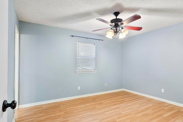 unfurnished room featuring ceiling fan, a textured ceiling, and light hardwood / wood-style flooring