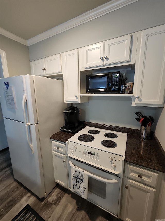 kitchen with dark hardwood / wood-style floors, ornamental molding, white appliances, and white cabinetry