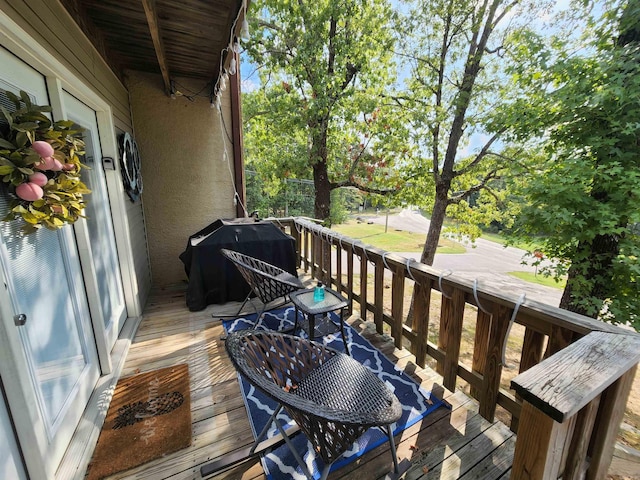 wooden deck featuring grilling area