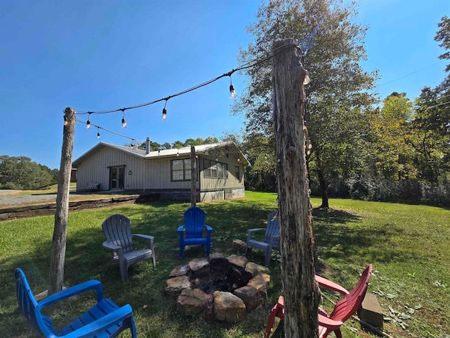 view of yard with a fire pit