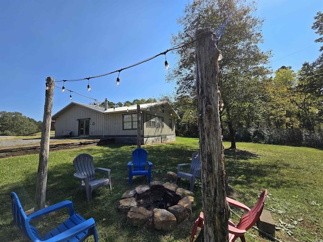 3189 Brownsville Rd, Greers Ferry, AR 72067 - view of grassy yard featuring a fire pit