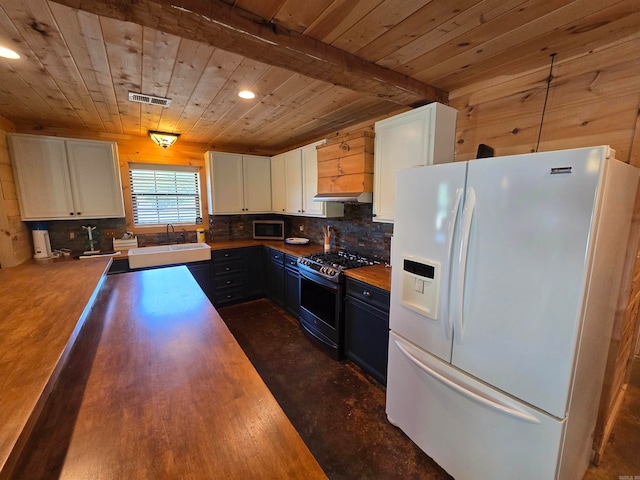 kitchen with blue cabinets, black gas range, white fridge with ice dispenser, decorative light fixtures, and white cabinetry