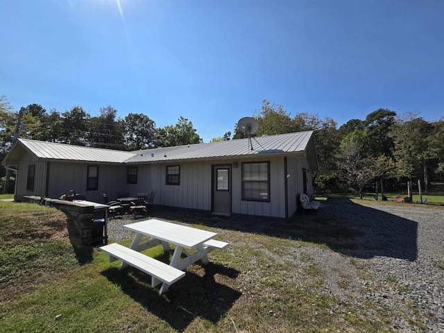 3189 Brownsville Rd, Greers Ferry, AR 72067 - rear view of property featuring board and batten siding and metal roof