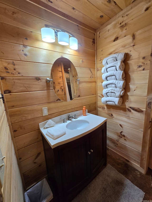 bathroom featuring wood ceiling, wooden walls, and vanity