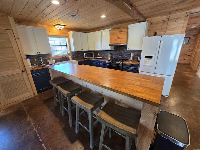 3189 Brownsville Rd, Greers Ferry, AR 72067 - kitchen featuring stainless steel appliances, wood ceiling, white cabinets, a breakfast bar area, and blue cabinets