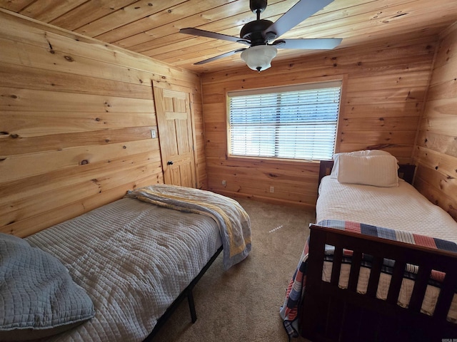 3189 Brownsville Rd, Greers Ferry, AR 72067 - carpeted bedroom featuring wooden walls, wood ceiling, and a ceiling fan