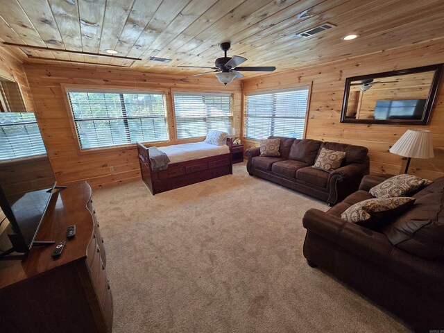 3189 Brownsville Rd, Greers Ferry, AR 72067 - carpeted living room featuring wood walls, healthy amount of natural light, wooden ceiling, ceiling fan, and recessed lighting
