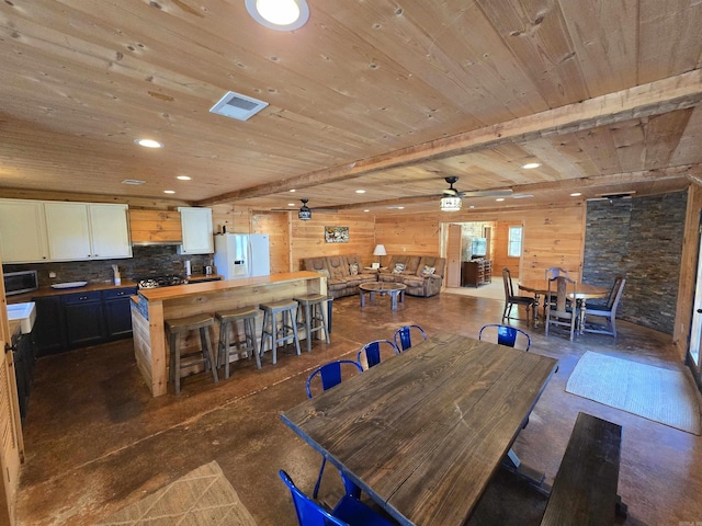 3189 Brownsville Rd, Greers Ferry, AR 72067 - dining space featuring wooden ceiling, ceiling fan, wood walls, recessed lighting, and concrete floors