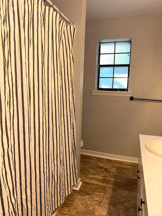 bathroom with vanity and toilet