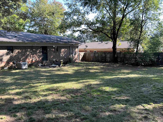 view of yard with central AC unit