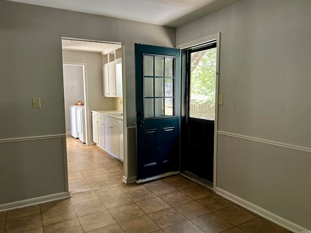 doorway to outside featuring washer / clothes dryer