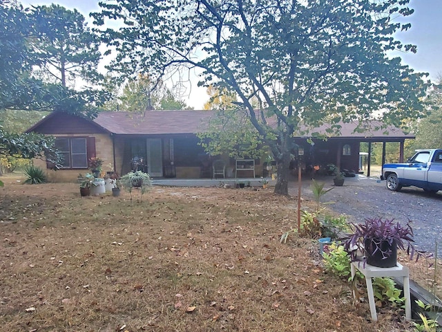 back of property featuring a carport