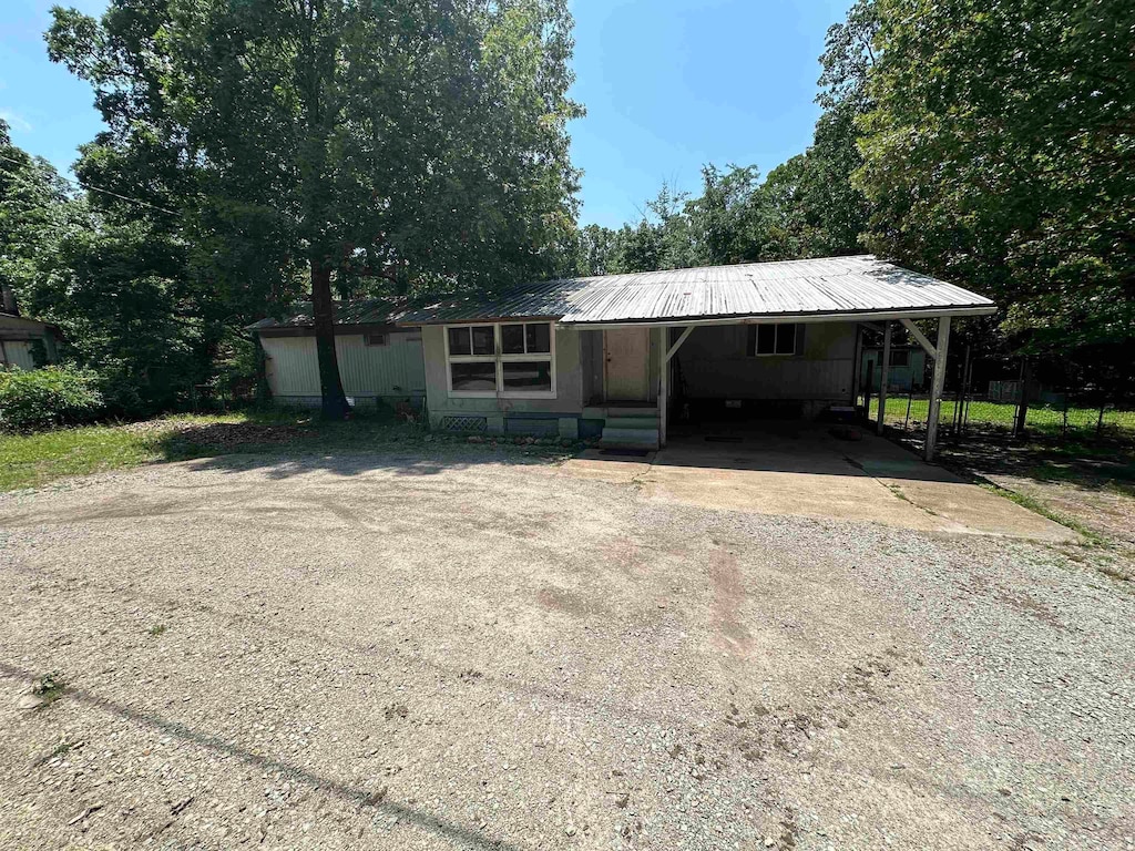 view of front facade with a carport