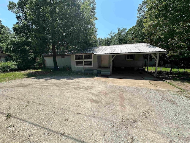 view of front facade with a carport