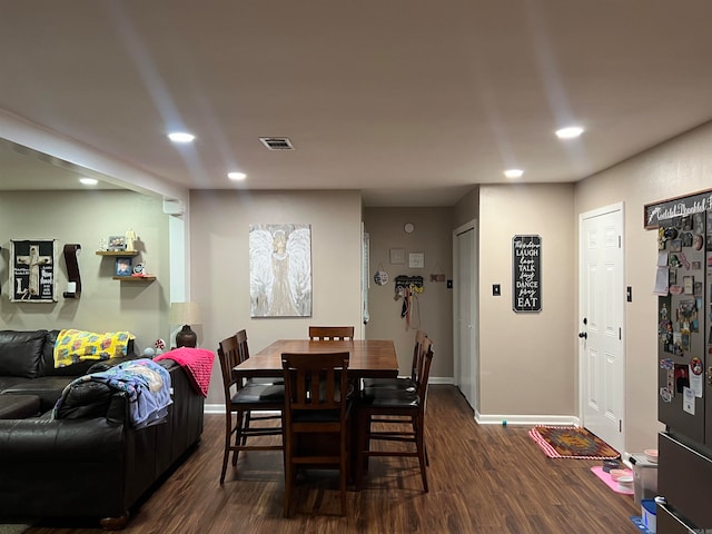 dining room featuring dark wood-type flooring