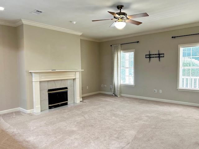 unfurnished living room with light colored carpet, a wealth of natural light, and ceiling fan