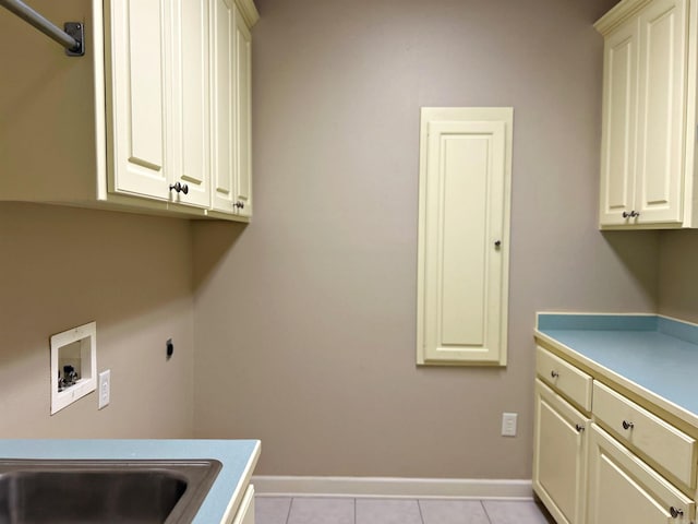 laundry area featuring washer hookup, cabinets, light tile patterned floors, and hookup for an electric dryer