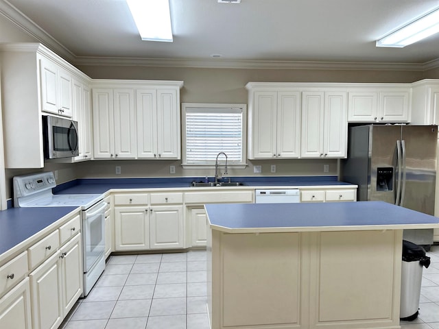 kitchen with a center island, white cabinets, sink, crown molding, and appliances with stainless steel finishes