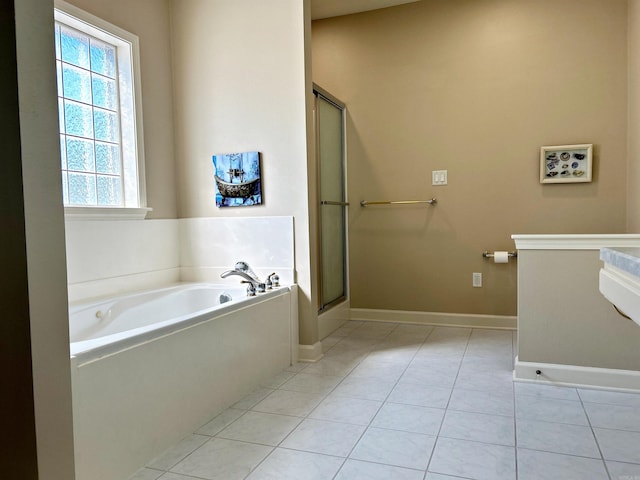 bathroom with tile patterned floors and plus walk in shower