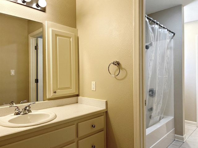 bathroom with tile patterned floors, shower / bath combination with curtain, and vanity