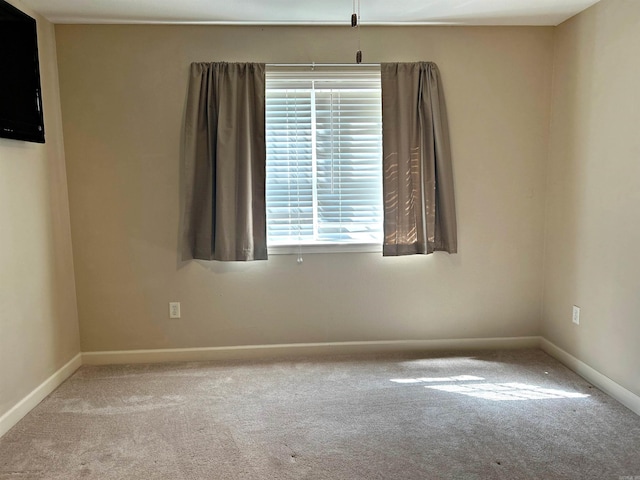 empty room featuring light colored carpet