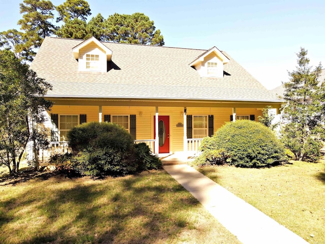 view of front of house featuring a porch and a front lawn