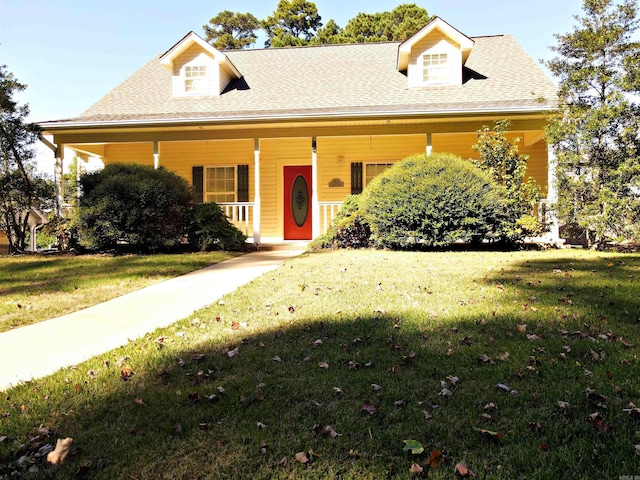 view of front of property with a porch and a front lawn