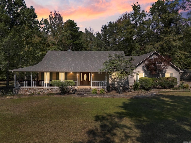 view of front of home with a yard and a porch