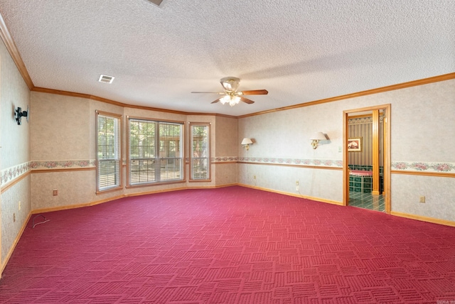 unfurnished room featuring ceiling fan, ornamental molding, and a textured ceiling