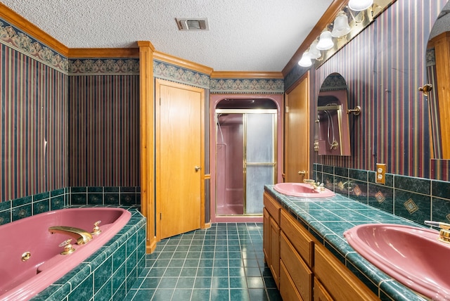 bathroom with crown molding, tile patterned floors, shower with separate bathtub, vanity, and a textured ceiling