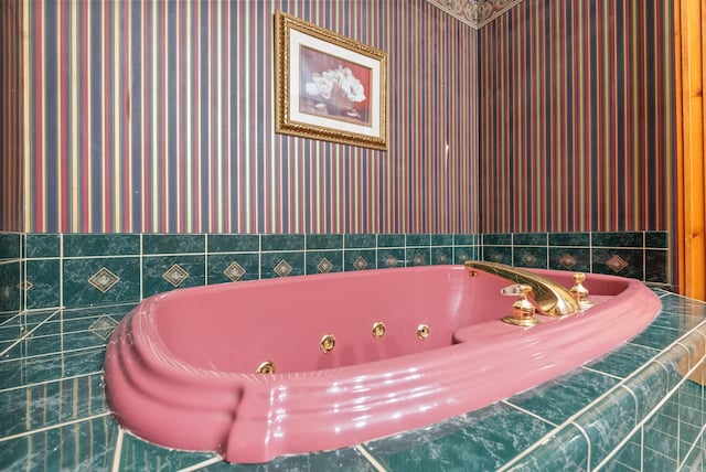 bathroom with a relaxing tiled tub