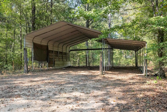 view of parking / parking lot with a carport