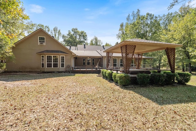 rear view of house with a yard