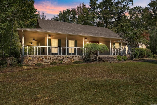 view of front of property with a yard and covered porch