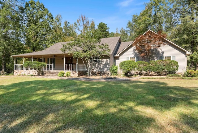 view of front facade featuring a front yard and covered porch