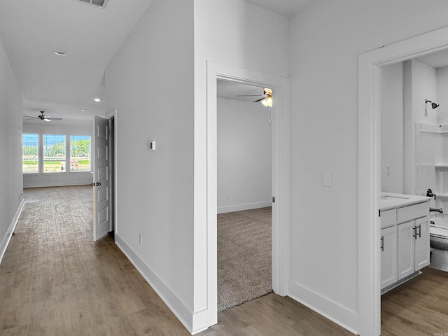 corridor featuring light wood-type flooring