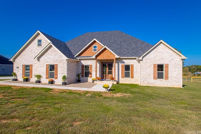 view of front of house featuring a front lawn and a patio