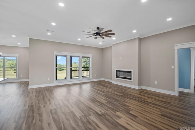 unfurnished living room with hardwood / wood-style flooring, crown molding, and plenty of natural light