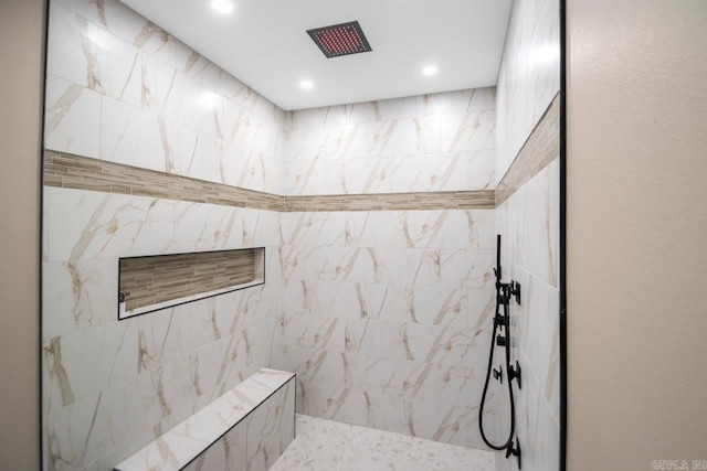 bathroom with tiled shower