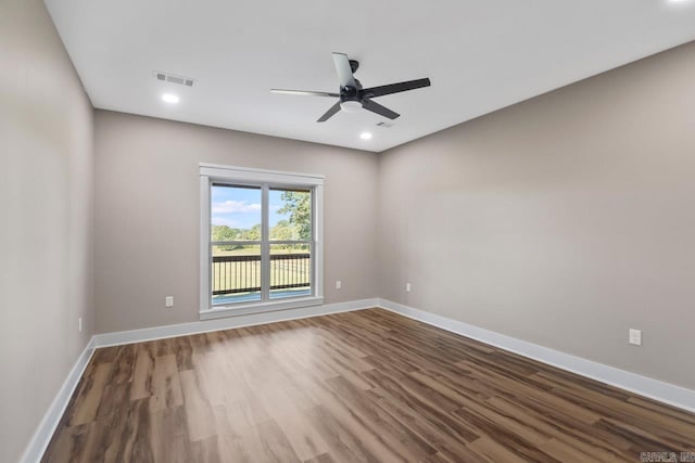 spare room with ceiling fan and hardwood / wood-style floors