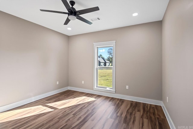 unfurnished room with ceiling fan and dark hardwood / wood-style floors