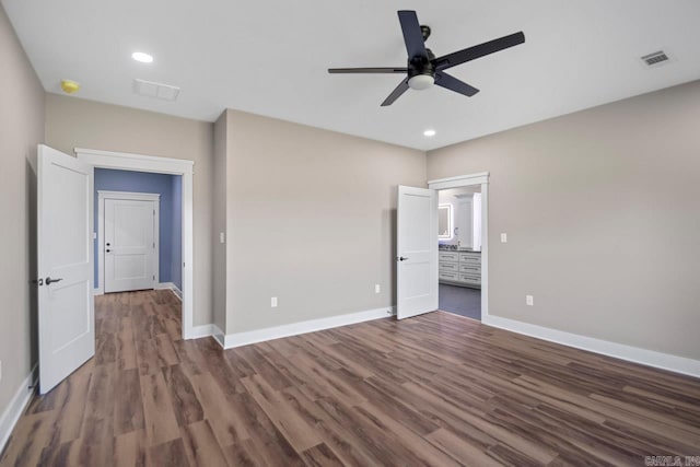 unfurnished bedroom featuring dark hardwood / wood-style floors and ceiling fan