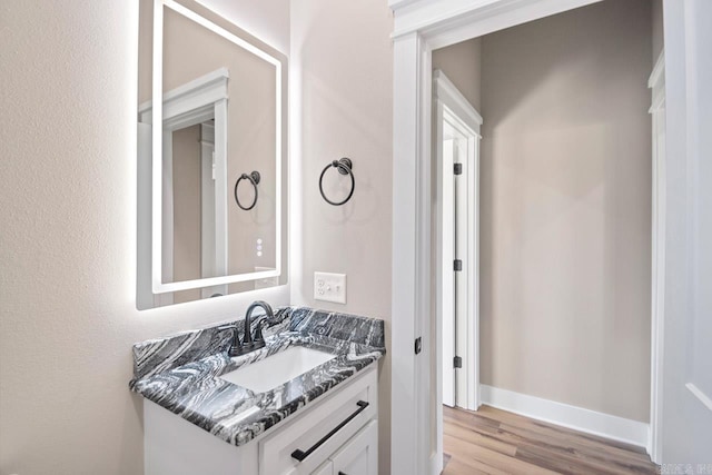 bathroom with vanity and wood-type flooring