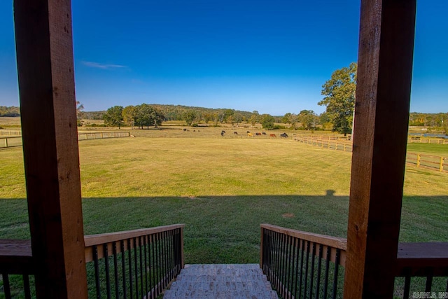 view of yard with a rural view