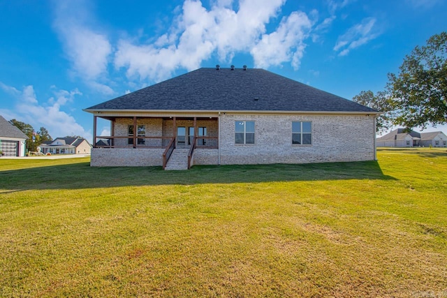 back of house featuring a yard