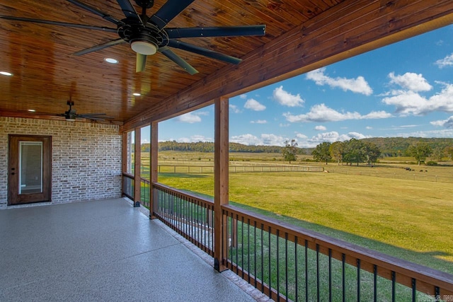 view of patio featuring a rural view and ceiling fan